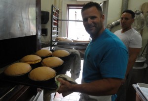 Agigian (left) and DiBartolo, Jr. at work in the kitchen at DiBartolo Bakery in Collingswood. Credit: Matt Skoufalos.