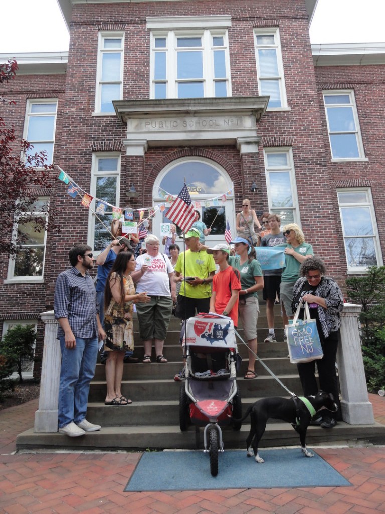 A crowd of supporters from GMO Free NJ joins Collingswood Commissioner Joan Leonard in greeting the Wilcox family on their 3,000-mile run. Credit: Matt Skoufalos