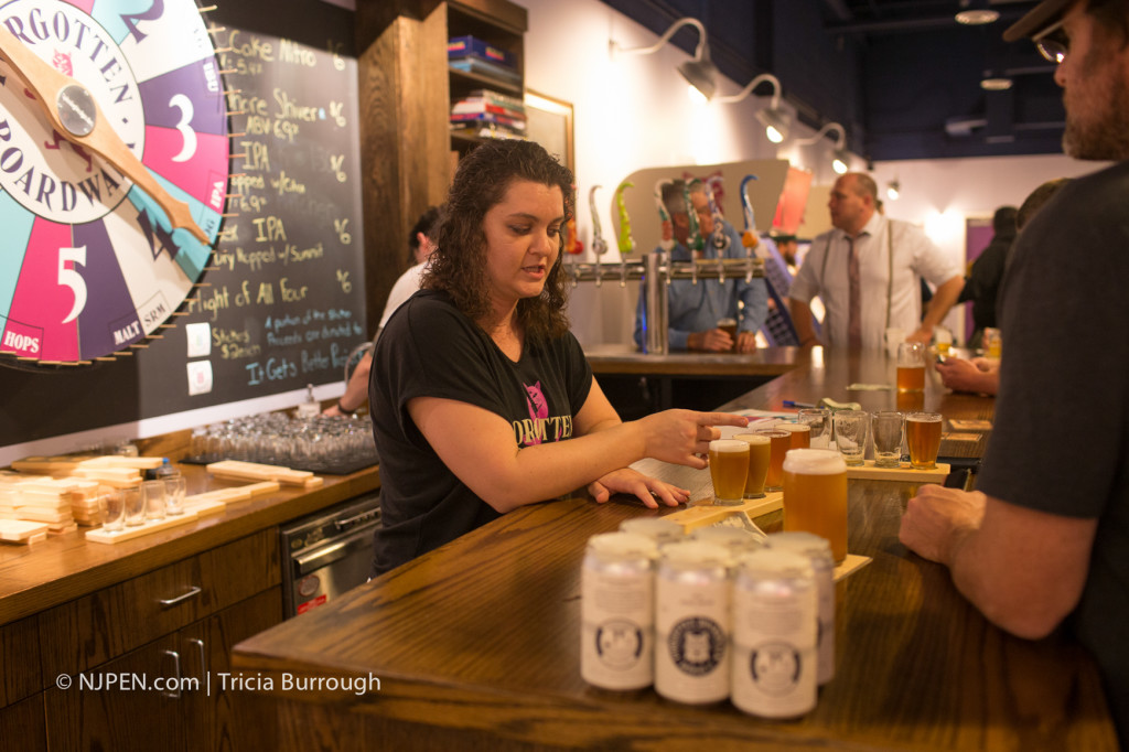 Jamie Queli serves up drinks at Forgotten Boardwalk. Credit: Tricia Burrough.