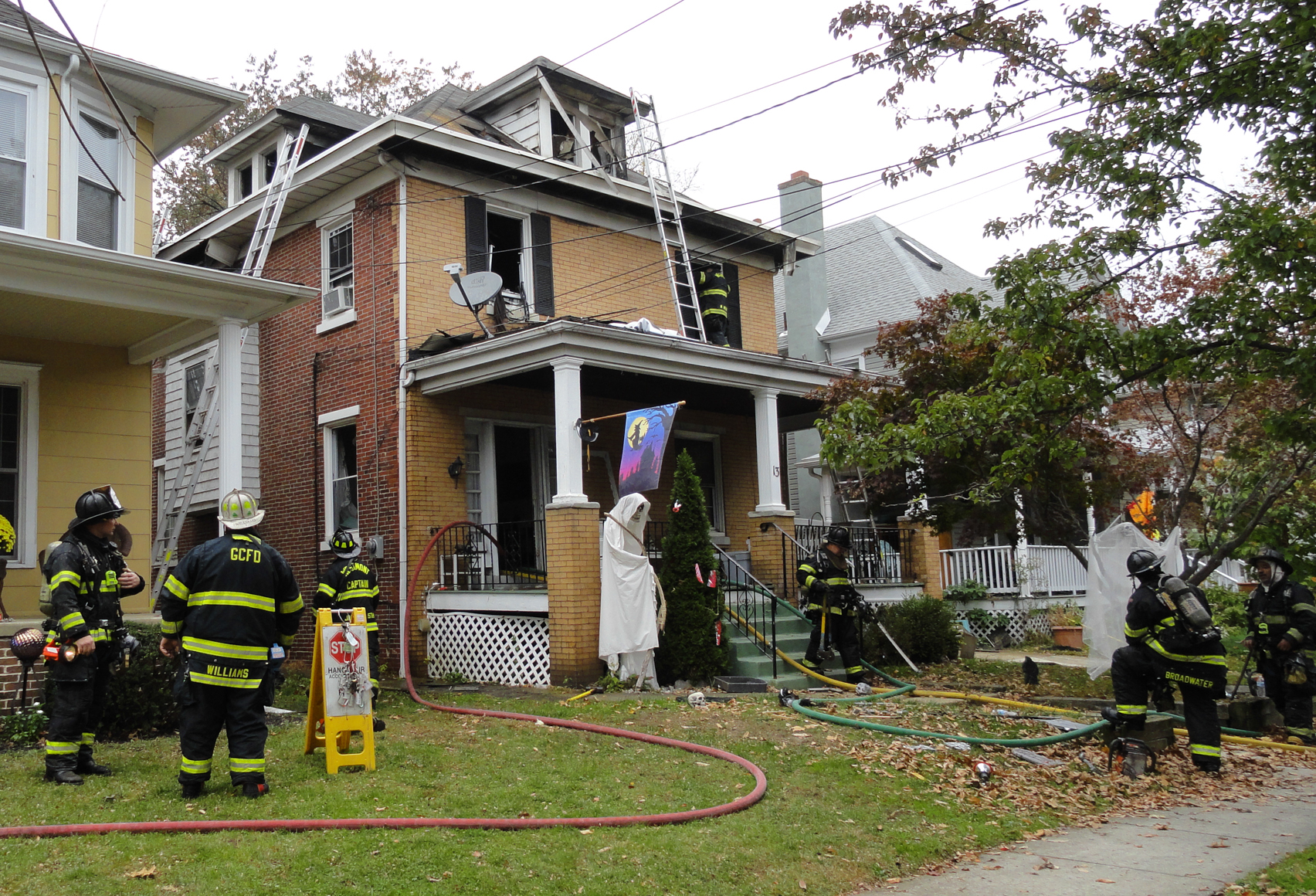 Firefighters wrap up at the scene of a Collingswood house fire. Credit: Matt Skoufalos.
