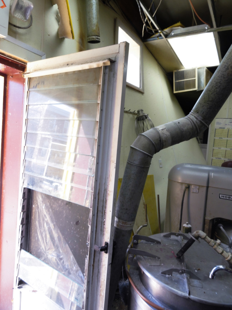 Interior wall of the bakery after the crash. Credit: Matt Skoufalos.