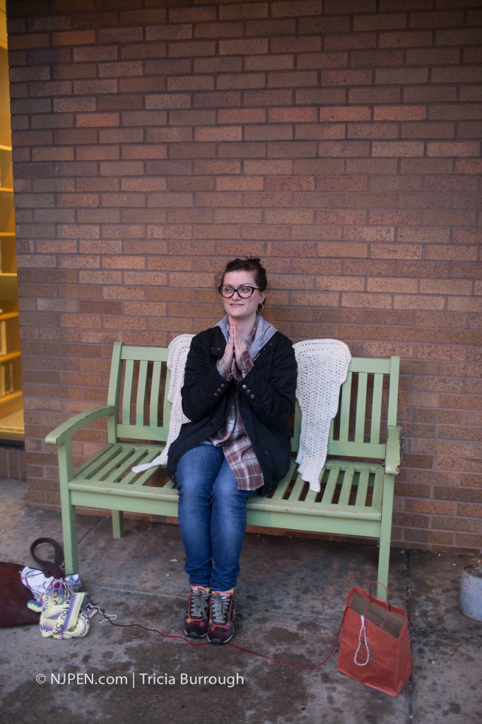 Shannon McGill and her yarnbomb. Credit: Tricia Burrough.