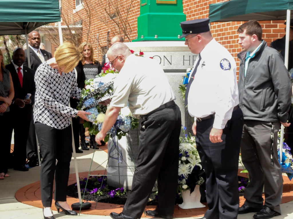 Laying wreaths at the memorial. Credit: Matt Skoufalos.