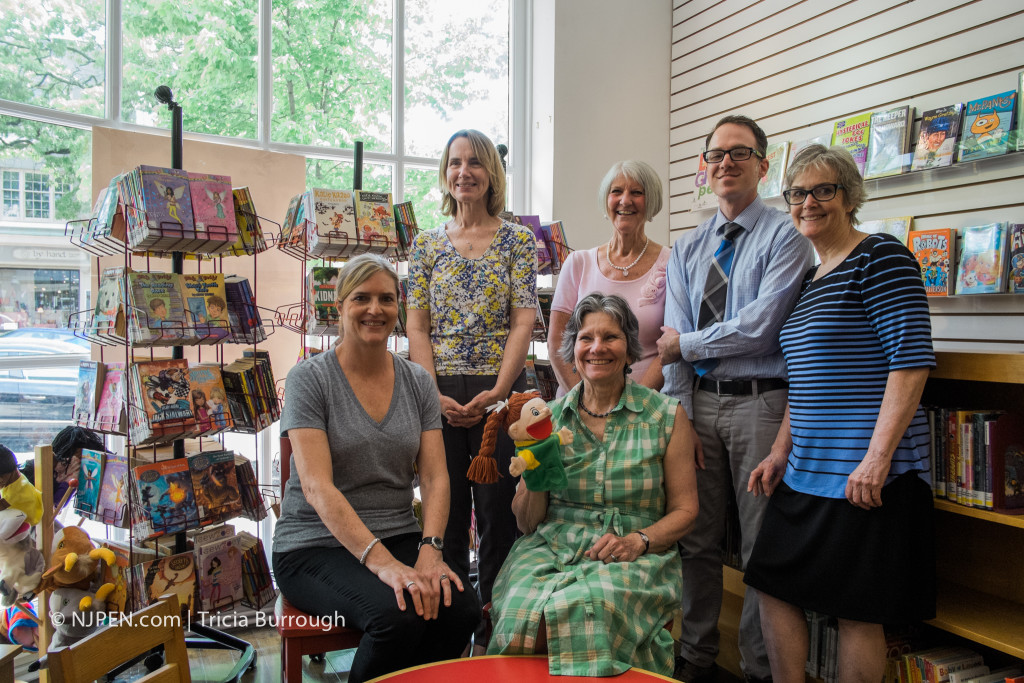 Zino (second from right) with library staffers Ginger O'Malley (seated, left), Kathleen Metrick, outgoing director Susan Briant (seated, right), Pam Alles, and Jeannie Reinking. Credit: Tricia Burrough.