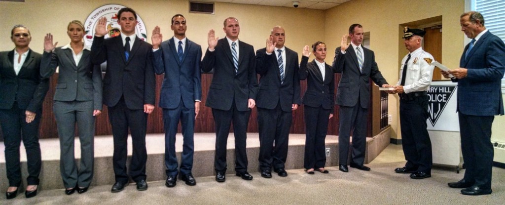 Cherry Hill police recruits take their oaths of office. Credit: Matt Skoufalos.