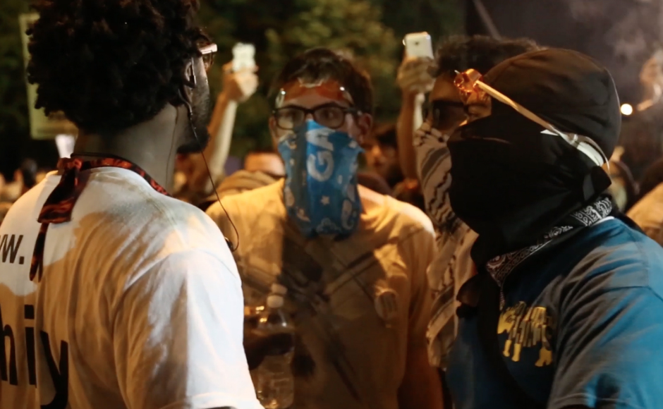 A demonstrator steps in to confront masked protesters at the DNC in Philadelphia. Credit: Steve Patrick Ercolani.
