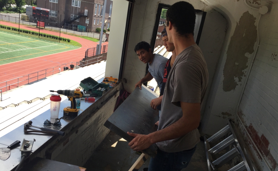 Sam Rivard and his friends overhaul the HMHS stadium press box. Credit: Karen Rivard.