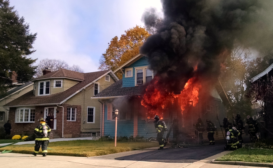 Firefighters battle a house fire on Eldridge Avenue in Collingswood. Credit: Matt Skoufalos.