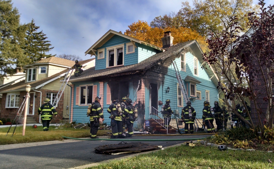 Firefighters battle a house fire on Eldridge Avenue in Collingswood. Credit: Matt Skoufalos.